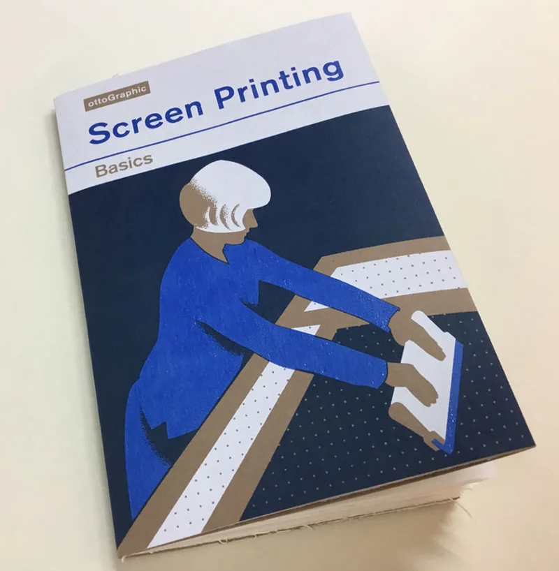 The printed cover of Screen Printing Basics: a figure in blue drawing a squeegee across a tilted screen, over a dark blue ground.
